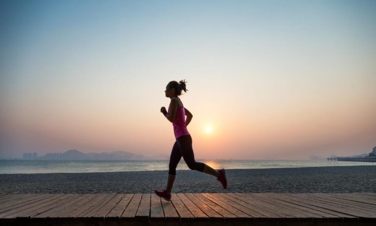 a woman running in the rehoboth marathon